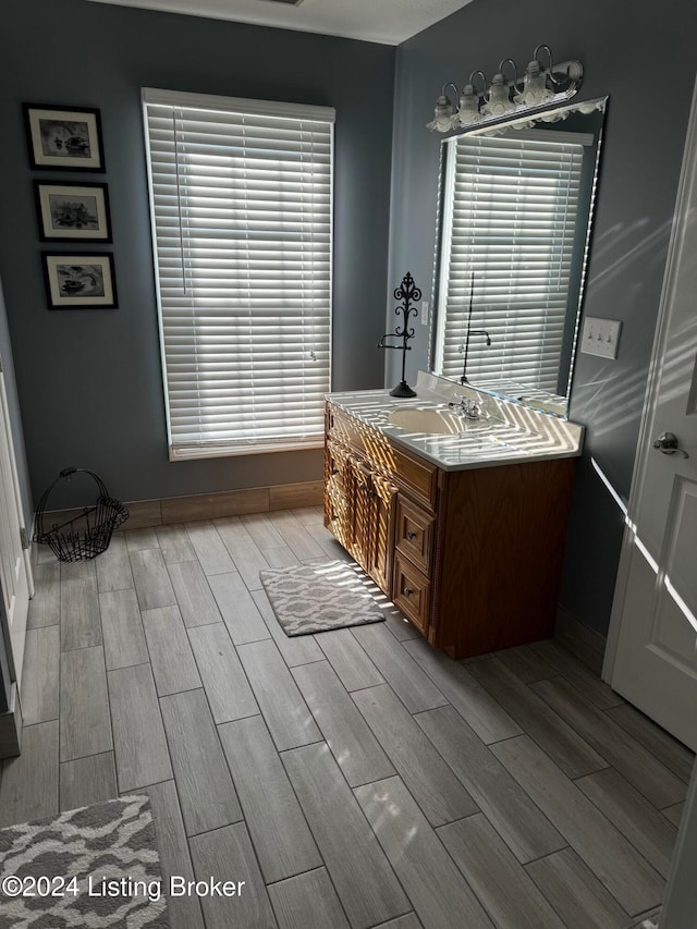 bathroom featuring vanity and wood-type flooring