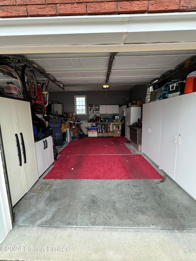 garage with white fridge