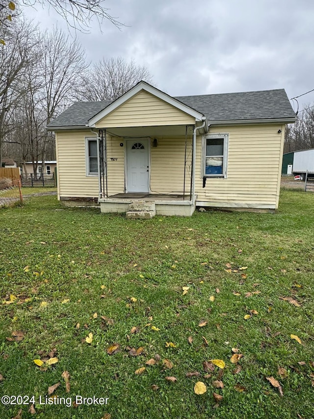 view of front of house featuring a front yard and a porch