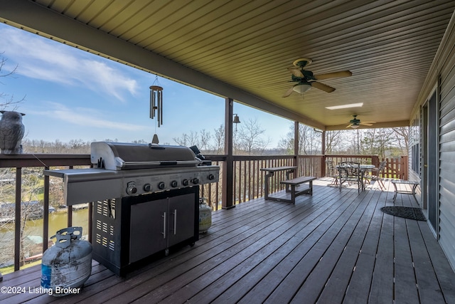 wooden deck featuring ceiling fan