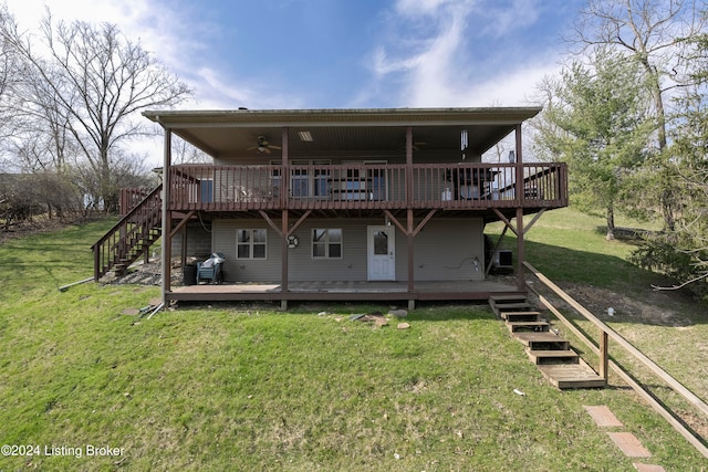 back of property featuring ceiling fan, a yard, and a deck