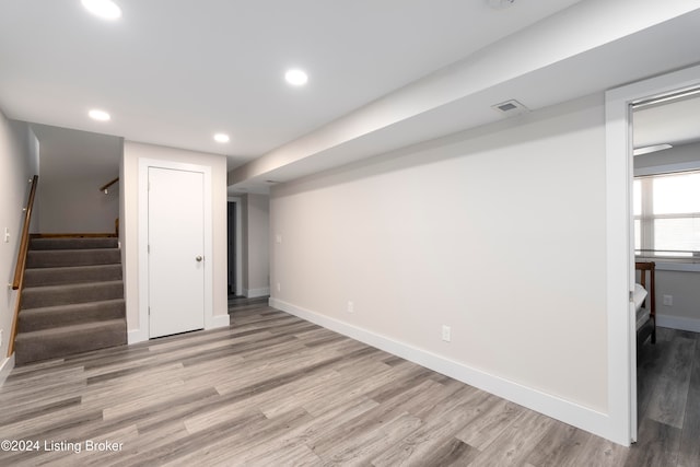 basement featuring light hardwood / wood-style floors