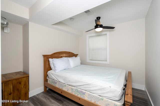 bedroom featuring ceiling fan and dark hardwood / wood-style floors