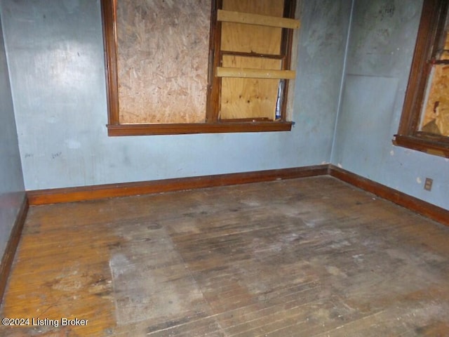 unfurnished room featuring dark hardwood / wood-style flooring