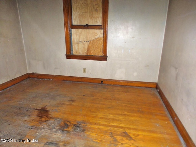 unfurnished room featuring wood-type flooring