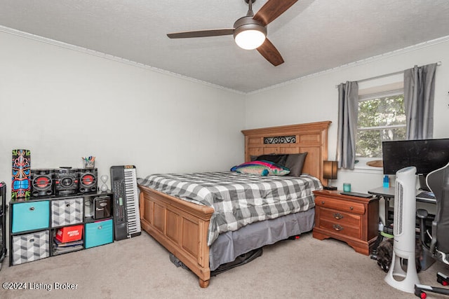 bedroom featuring ceiling fan, crown molding, light colored carpet, and a textured ceiling