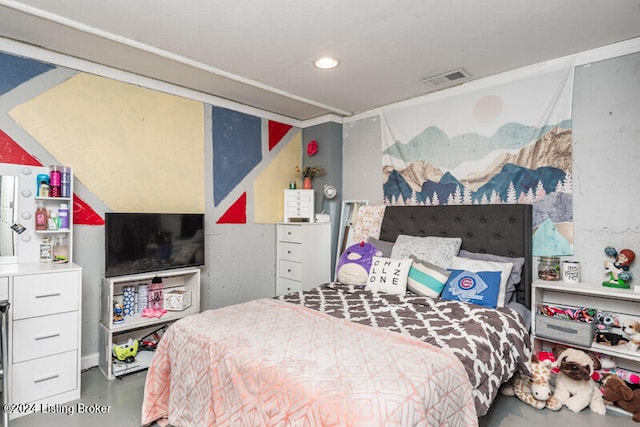 bedroom featuring concrete floors