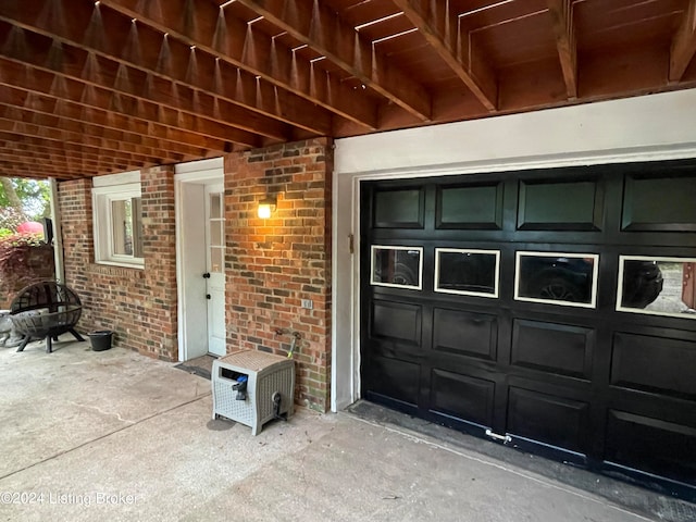 view of exterior entry with a garage