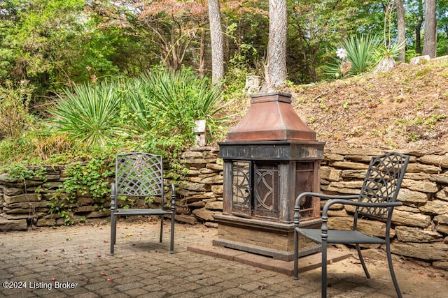 view of patio / terrace featuring a fireplace