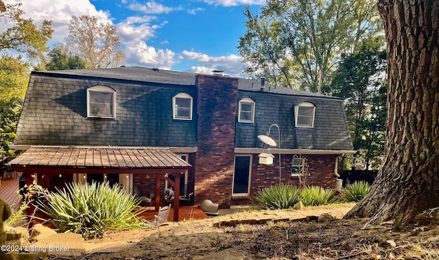 view of front of property with a wooden deck