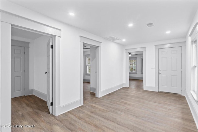 interior space with a closet and light hardwood / wood-style flooring