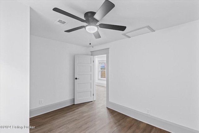 spare room with ceiling fan and dark hardwood / wood-style flooring