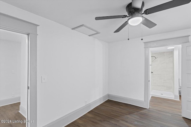 spare room with ceiling fan and dark hardwood / wood-style floors