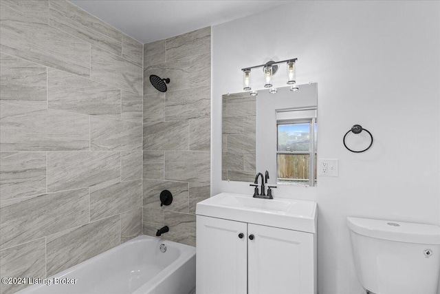 full bathroom with vanity, toilet, and tiled shower / bath