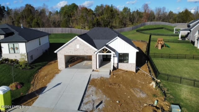 view of front of home with a front lawn and a garage