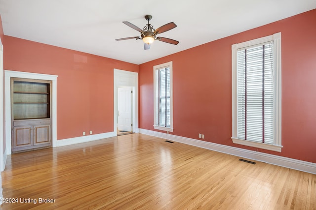 spare room with ceiling fan and light hardwood / wood-style flooring