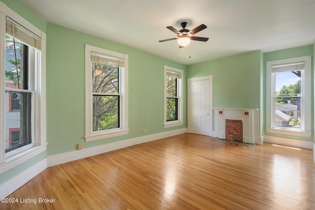 interior space with ceiling fan, light wood-type flooring, and a closet