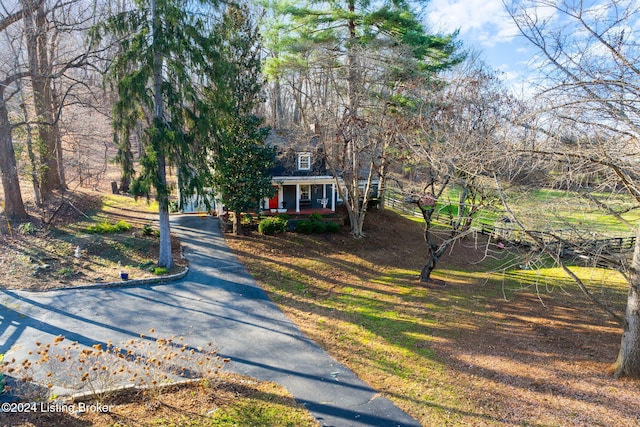 obstructed view of property with a porch