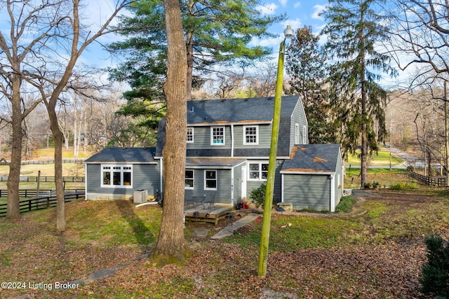 back of house featuring a yard