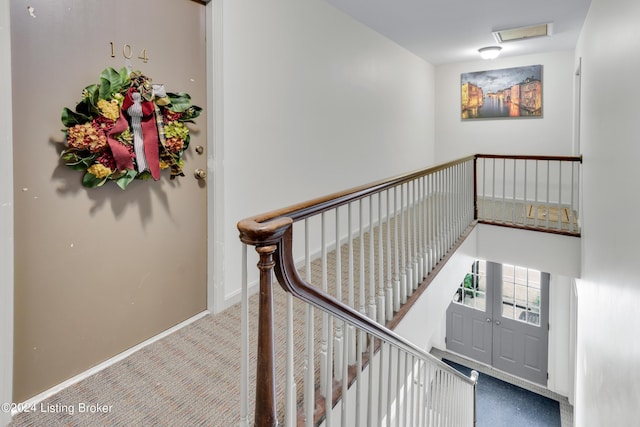 stairs with carpet floors