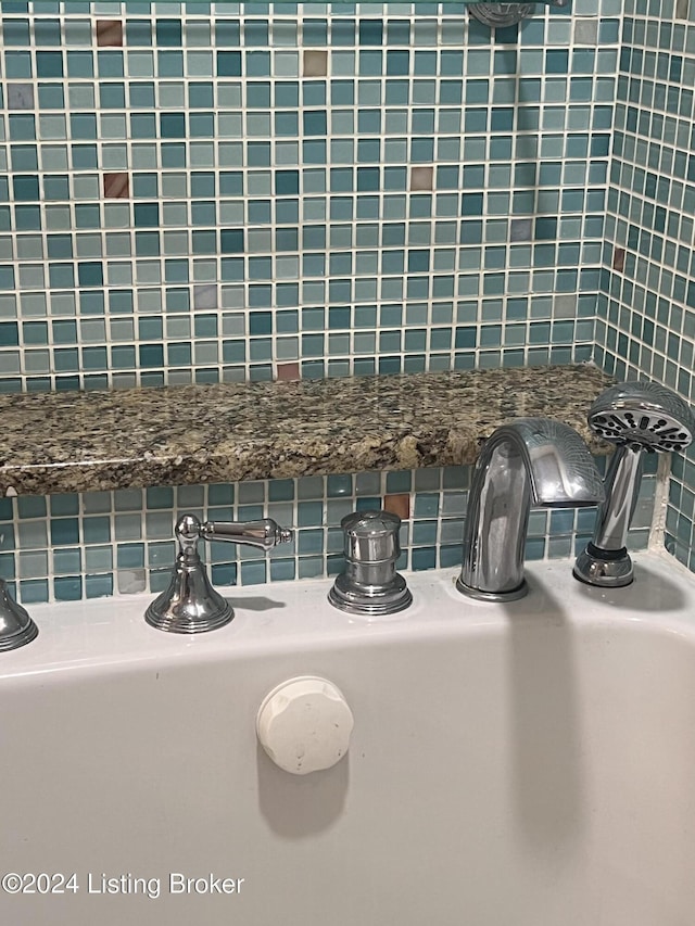 interior details with decorative backsplash and sink