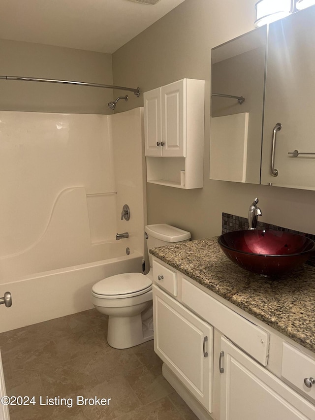 full bathroom with vanity,  shower combination, and toilet