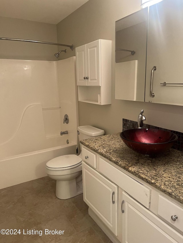 full bathroom with vanity,  shower combination, and toilet