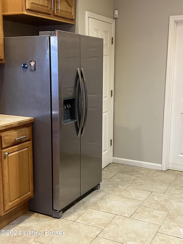 kitchen with stainless steel refrigerator with ice dispenser