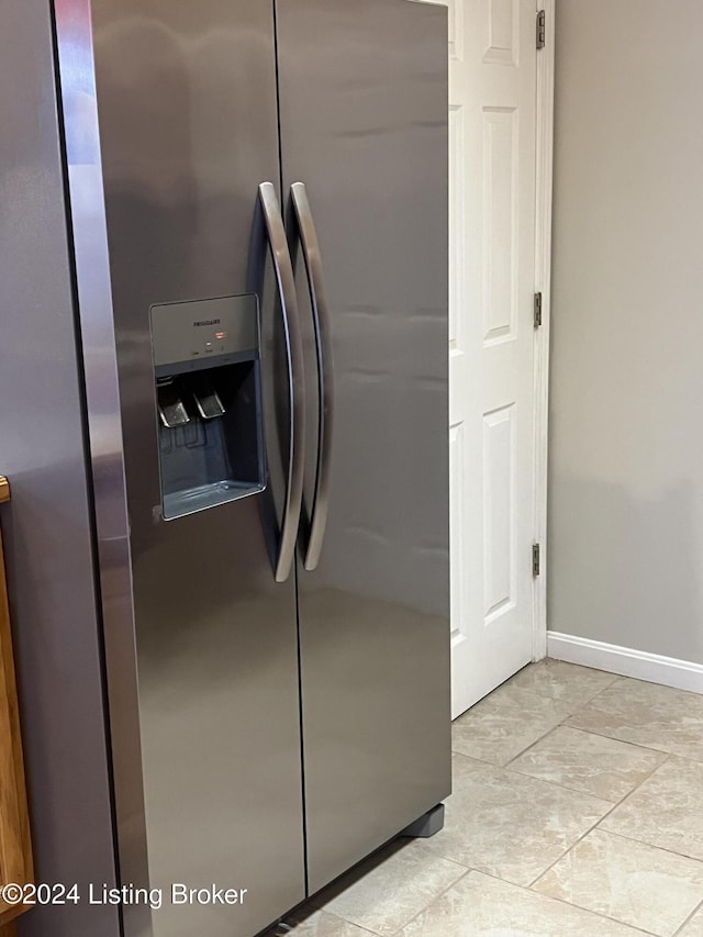 interior details featuring stainless steel fridge