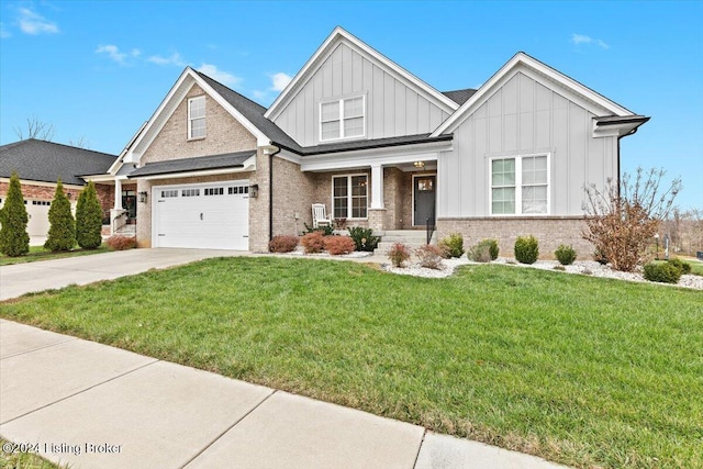 view of front of home with a front yard and a garage