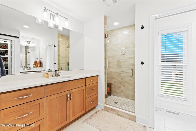 bathroom with vanity and walk in shower