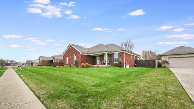 view of front of property with a garage and a front lawn