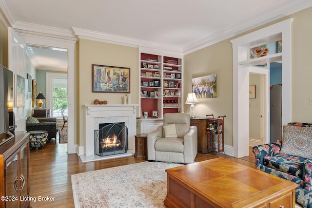 living room featuring crown molding and wood-type flooring