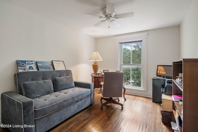 office space with hardwood / wood-style floors and ceiling fan