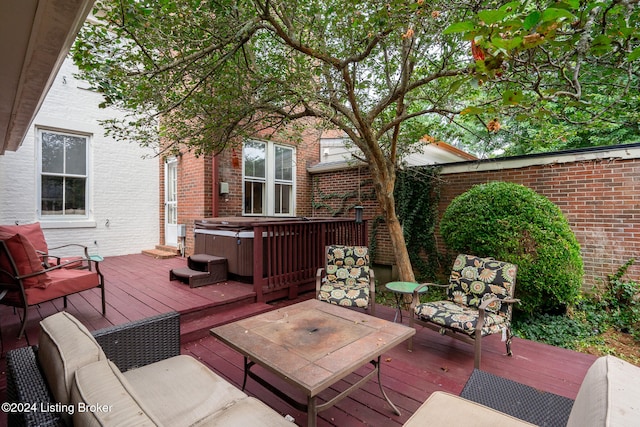 deck featuring an outdoor hangout area and a hot tub