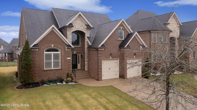 view of front of home featuring driveway, brick siding, a front lawn, and stone siding