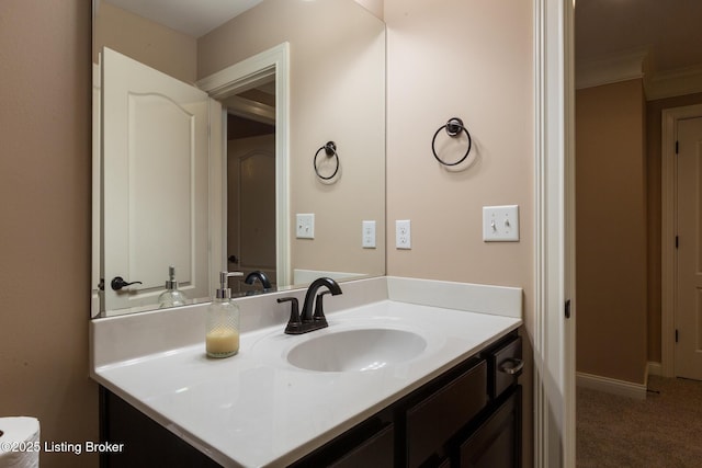 bathroom featuring vanity and baseboards