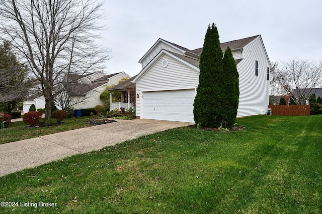 view of front facade with a front yard and a garage