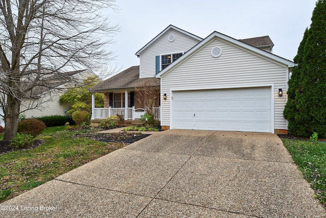 view of property featuring a garage and a porch