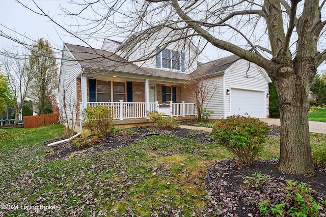 view of front facade featuring a garage, covered porch, and a front lawn