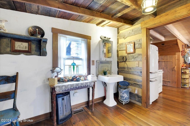 bathroom with vaulted ceiling with beams, wood-type flooring, and wood ceiling