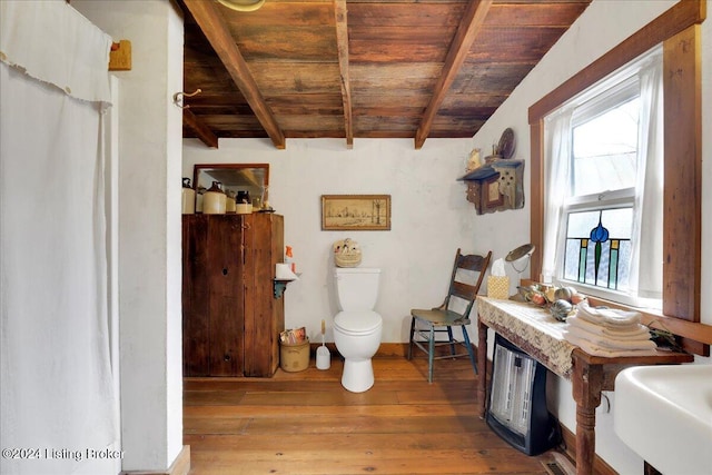 bathroom with lofted ceiling with beams, toilet, wood-type flooring, and wood ceiling