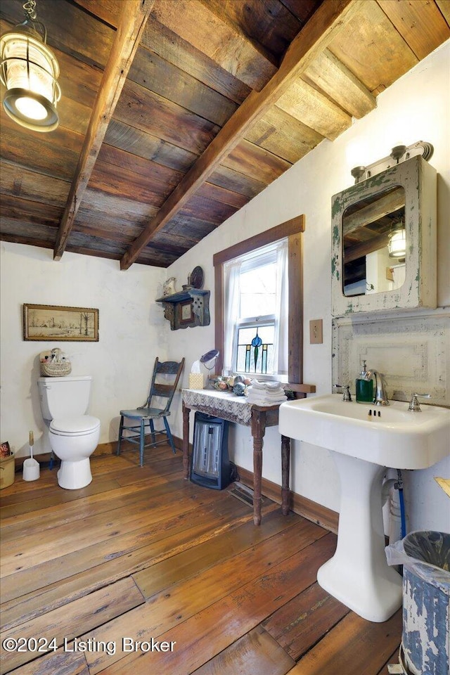 bathroom featuring hardwood / wood-style floors, vaulted ceiling with beams, toilet, and wood ceiling