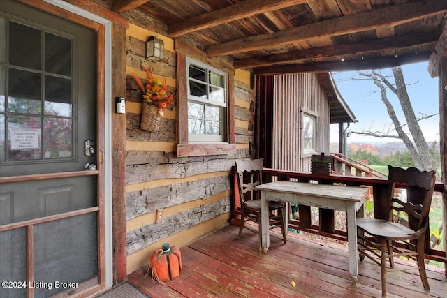 wooden terrace with a porch