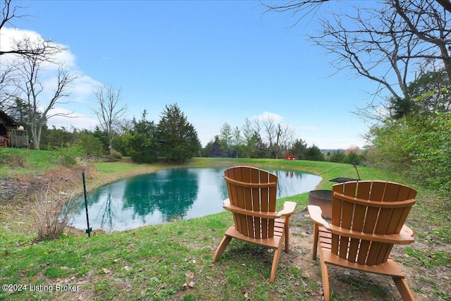 view of swimming pool with a water view