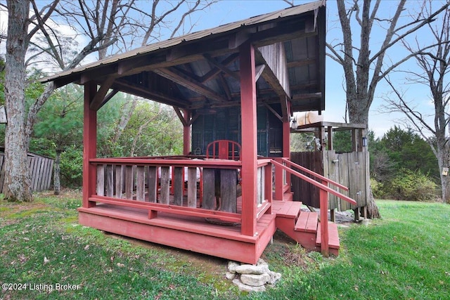 wooden terrace with a yard