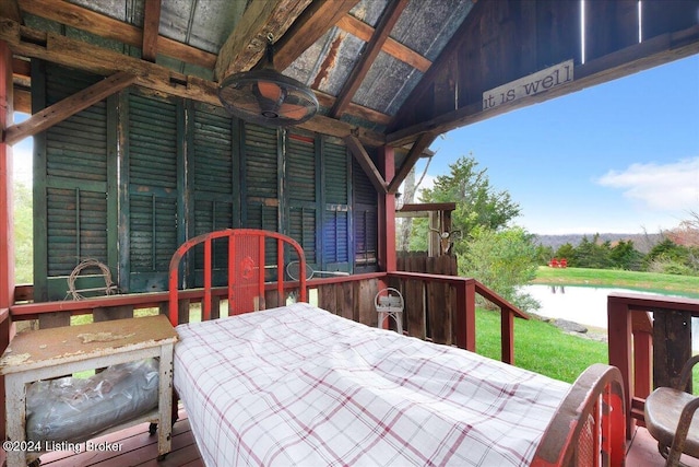 wooden deck with a water view