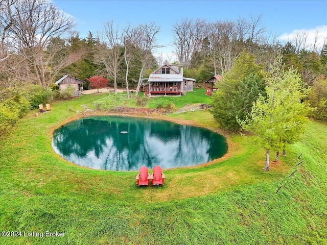 view of pool with a yard