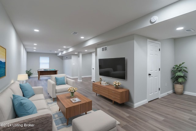 living room featuring pool table and light hardwood / wood-style flooring