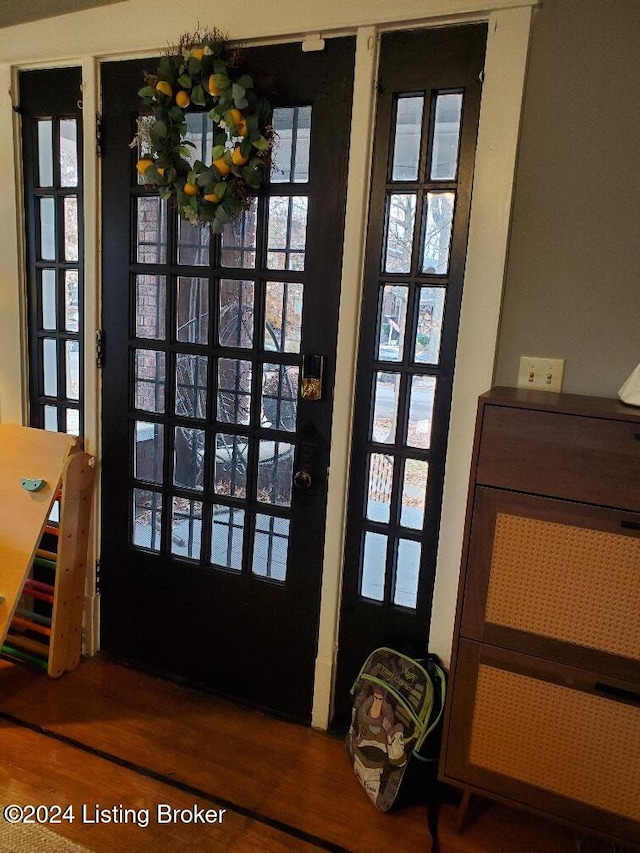 doorway to outside with french doors and wood-type flooring